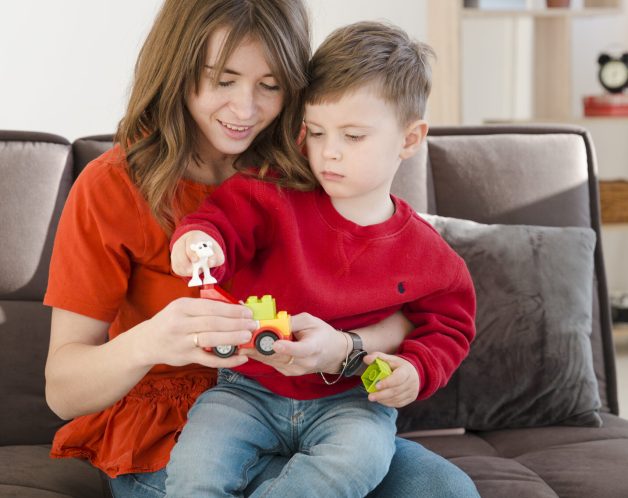 mom-helping-son-play